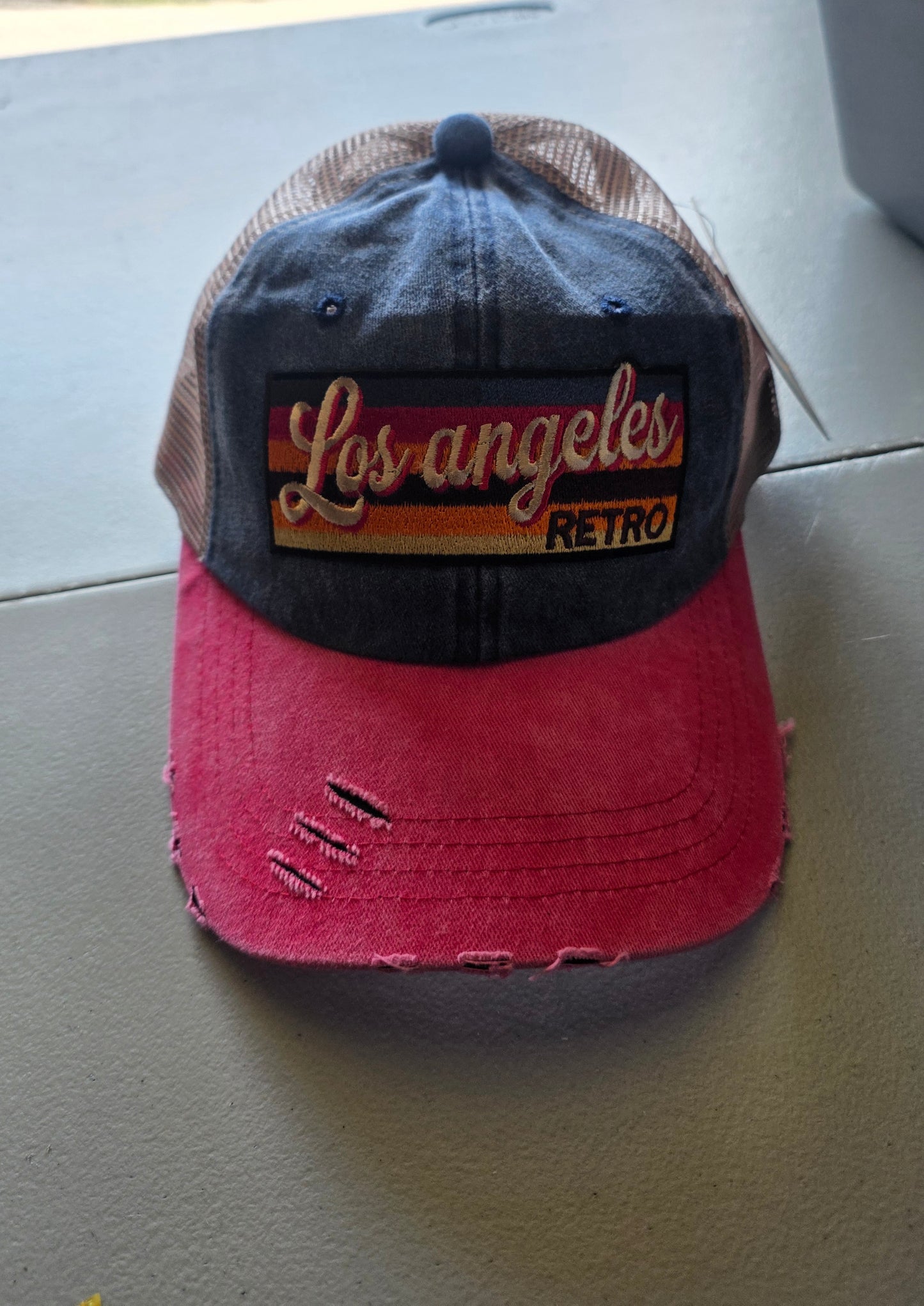 Pink and blue denim trucker hat