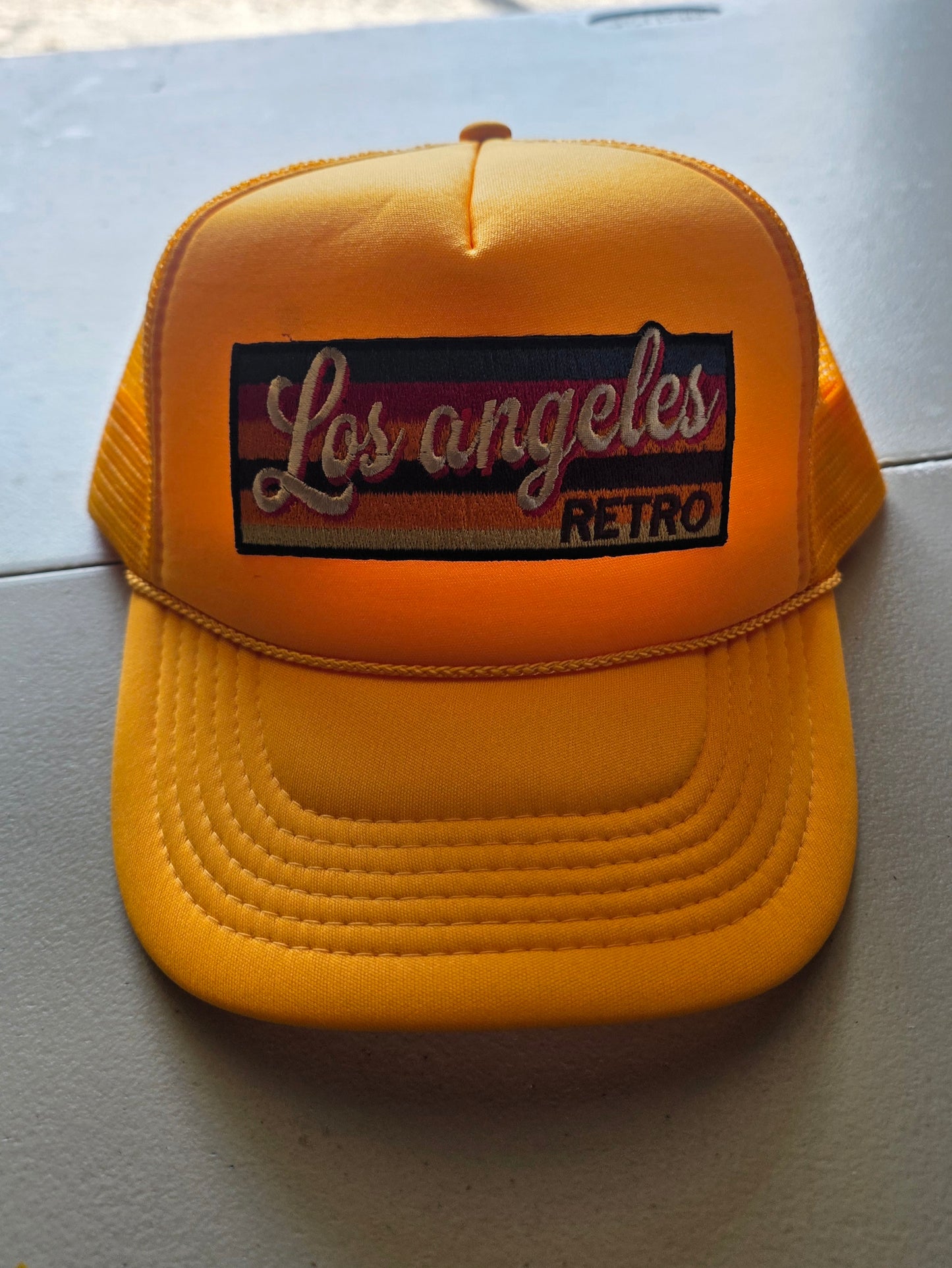 Yellow snapback trucker hat